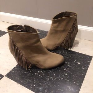 High heeled fringe boots